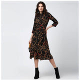 Womens long sleeved polyester dress with chain print below knee length in black, yellow