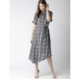 Black and white women's knee-length dress with short sleeves, featuring an animal print pattern