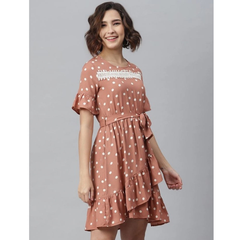 Woman in brown polka dot bell sleeve dress above knee