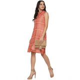 A sleeveless above-knee dress in a vibrant orange print on a polyester fabric