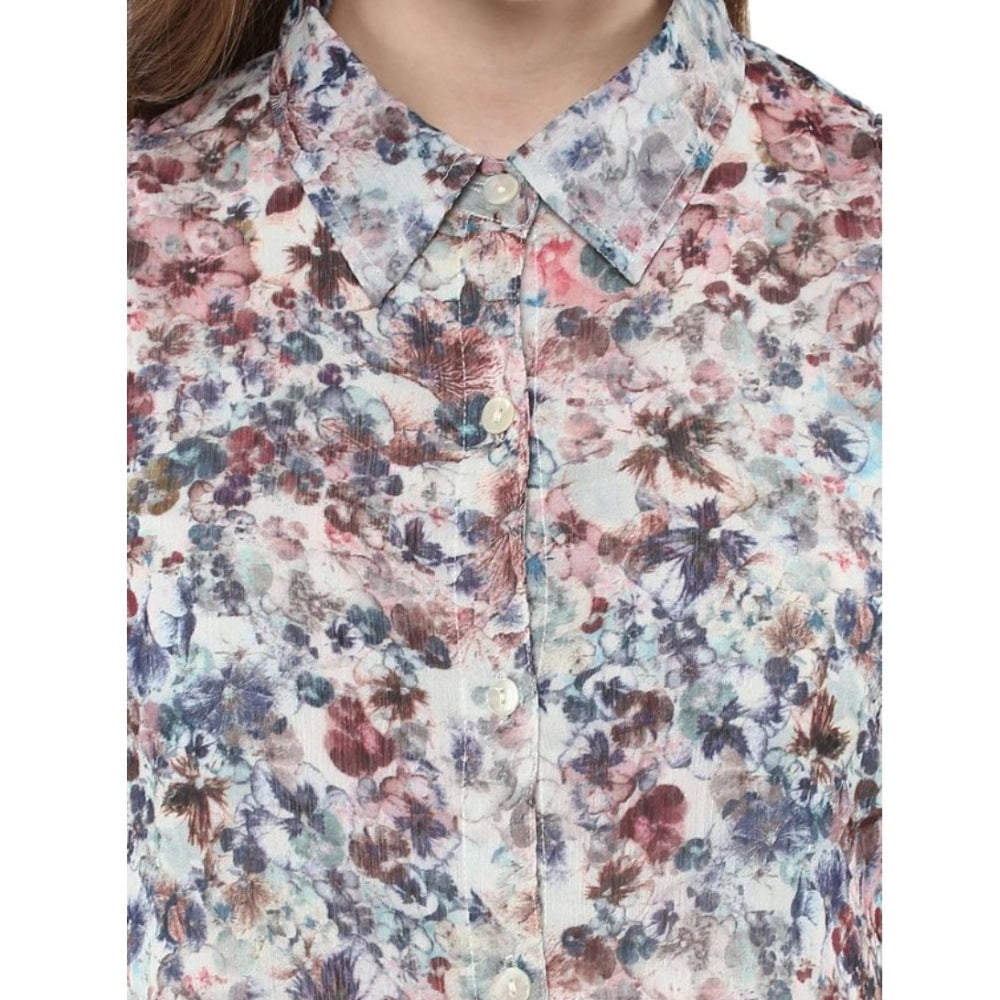 A sleeveless printed chiffon dress with a floral pattern