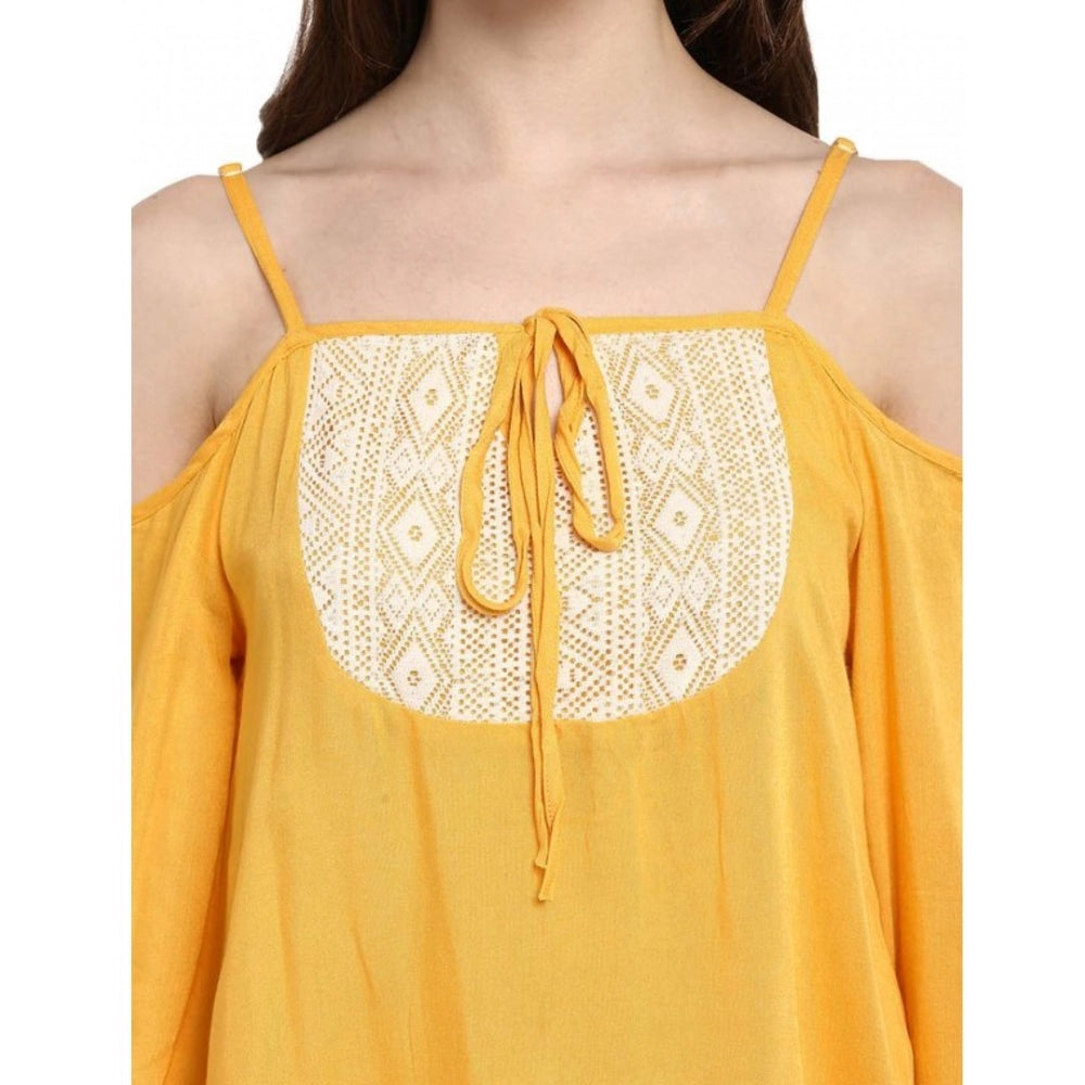 Mustard yellow rayon embellished cold shoulder top for women, rich pattern detailing on display