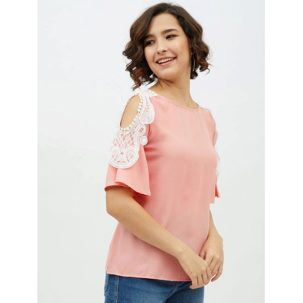 Pink polyester lace cold shoulder top with intricate lace inserts