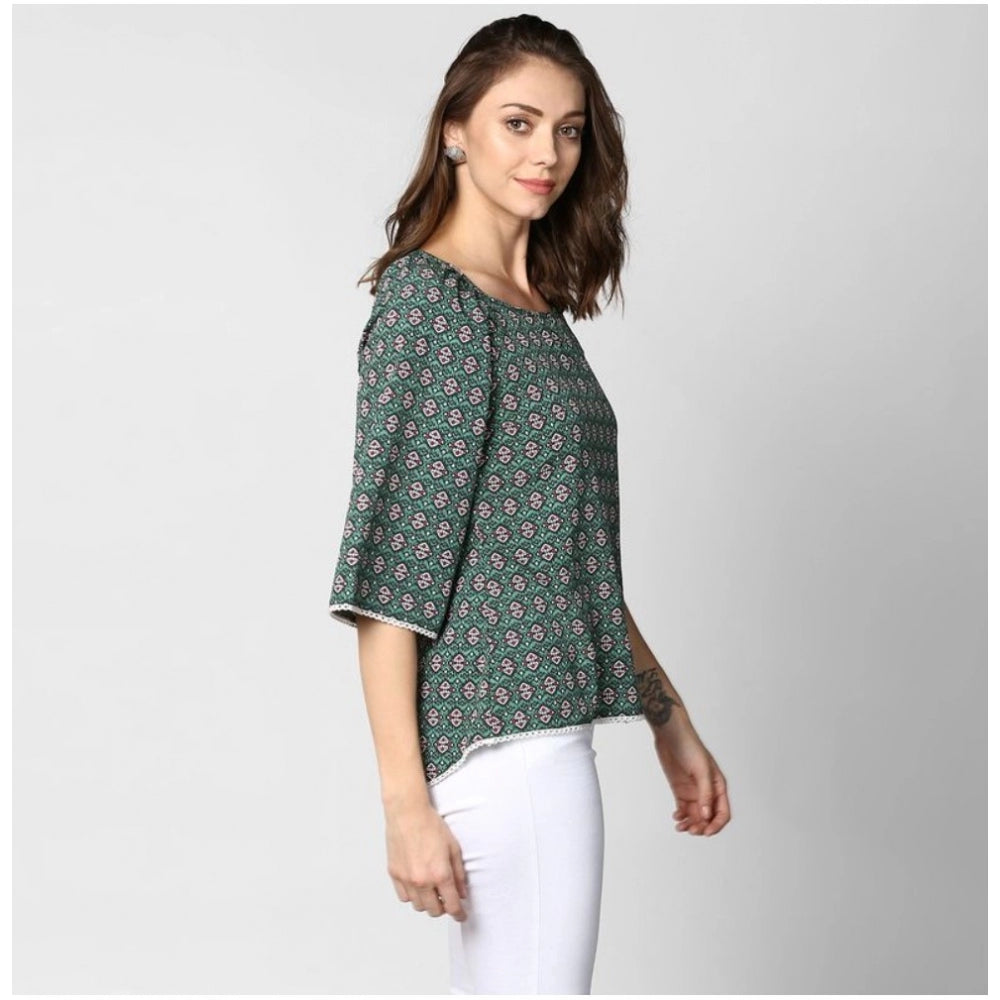 Women's green polyester printed 3/4th sleeves top with round neck, vibrant pattern detail