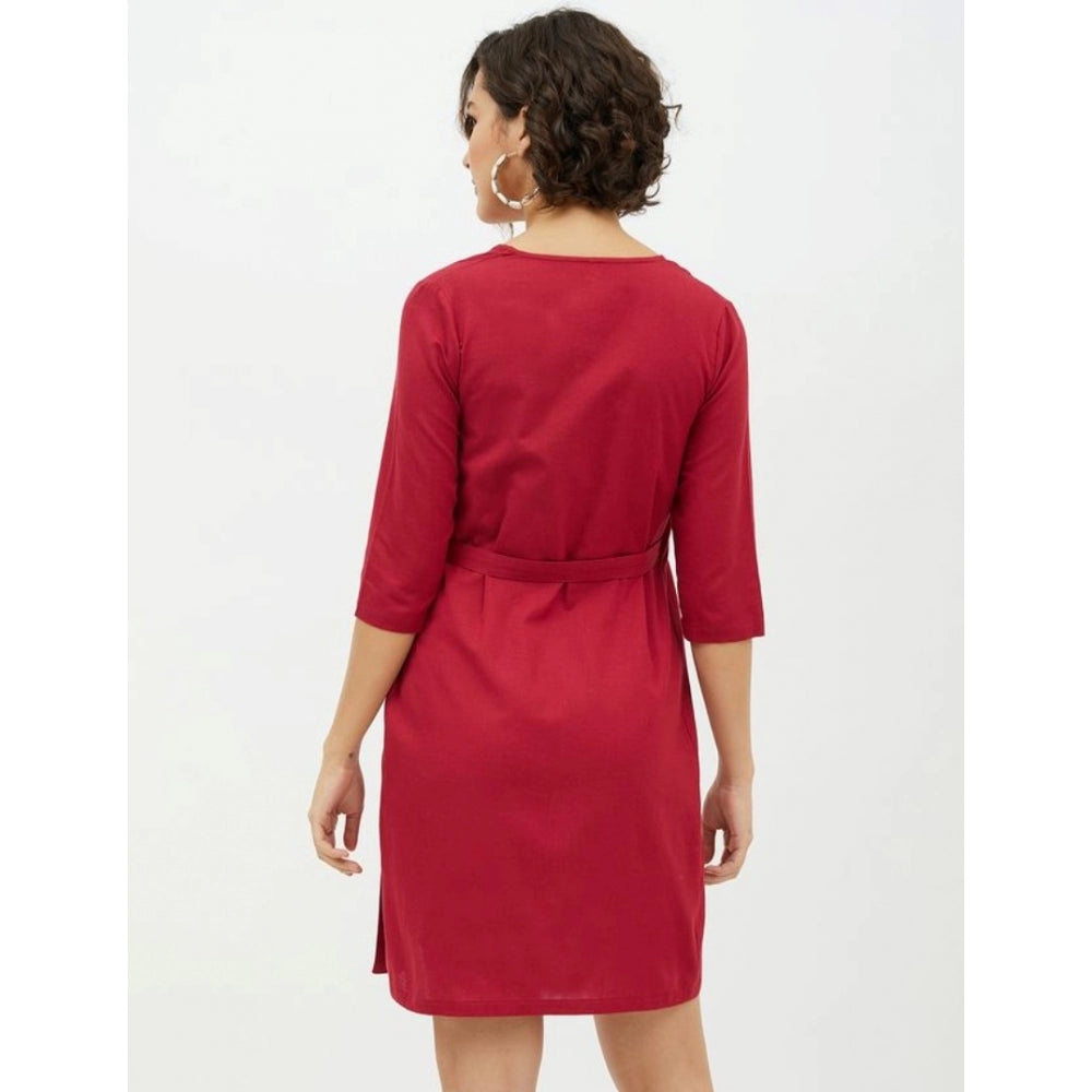 The image shows a maroon cotton wrap dress with long sleeves and a hemline above the knee