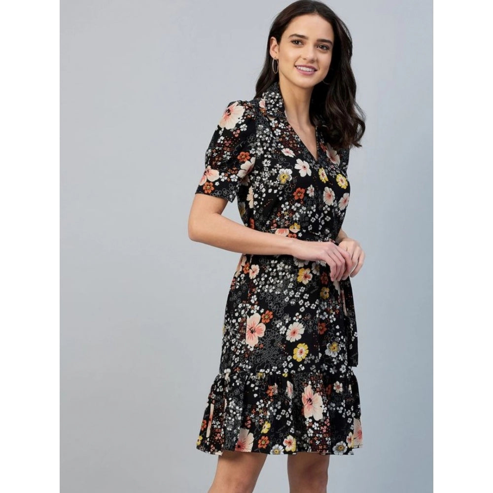 Black above-knee dress with floral print, short sleeves, and an open neckline