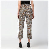 White-Yellow animal print polyester elastic trousers for women, vibrant pattern on display