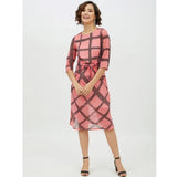 Pink polyester checkered women's dress with short sleeves and falls below the knee