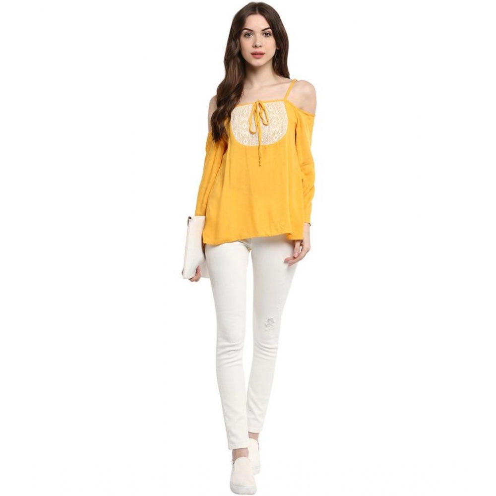 Mustard yellow rayon embellished cold shoulder regular top for women, close-up detail shows intricate design and off-shoulder style