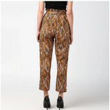 Orange-black polyester animal print elasticated trousers for women, fashionable and comfortable attire with stretchy waistband