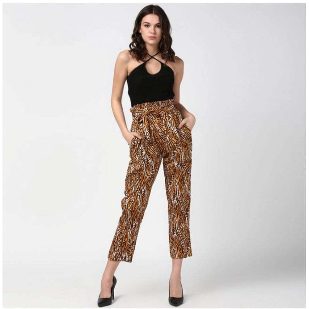 Women's orange-black animal print elasticated polyester trousers, vibrant pattern on display