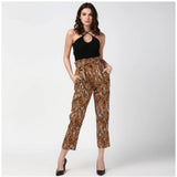 Women's orange-black animal print elasticated polyester trousers, vibrant pattern on display