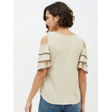 Beige polyester tiered cold shoulder top for women, round neck style on mannequin