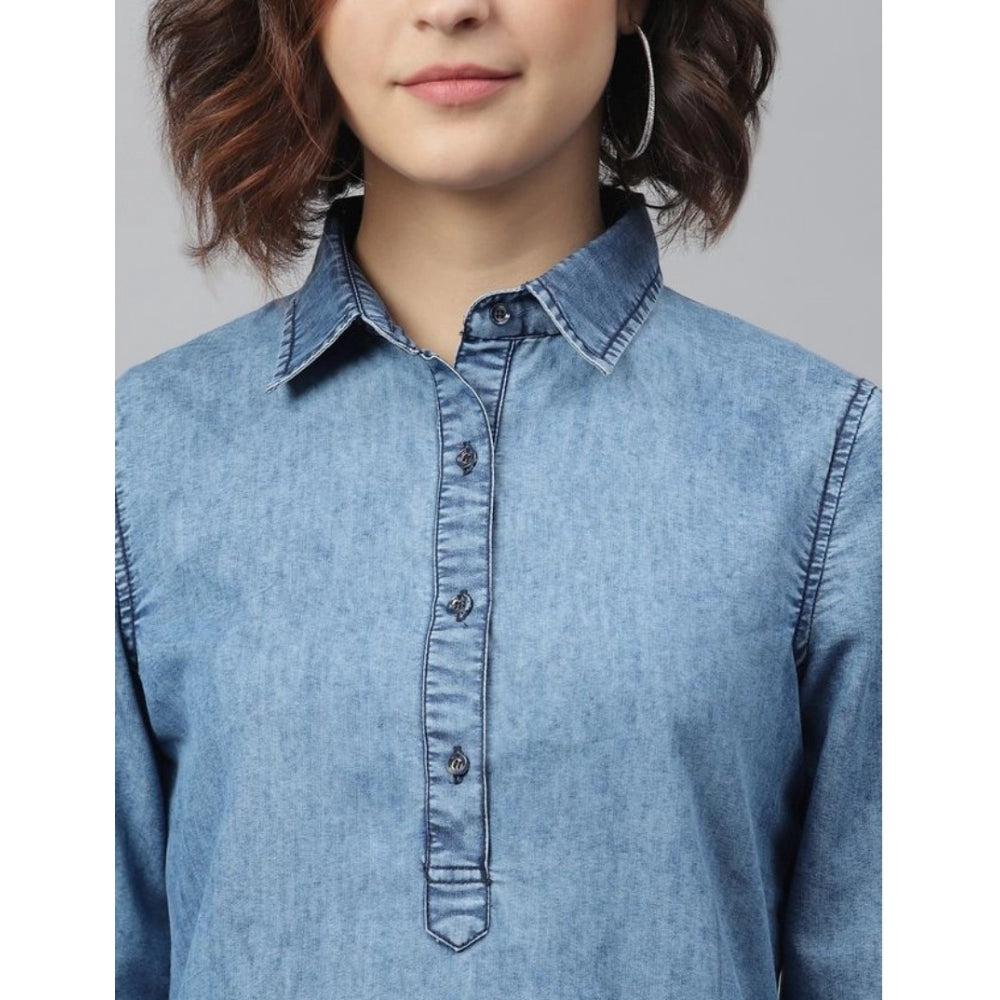A woman wearing a long sleeve denim dress, ice blue color