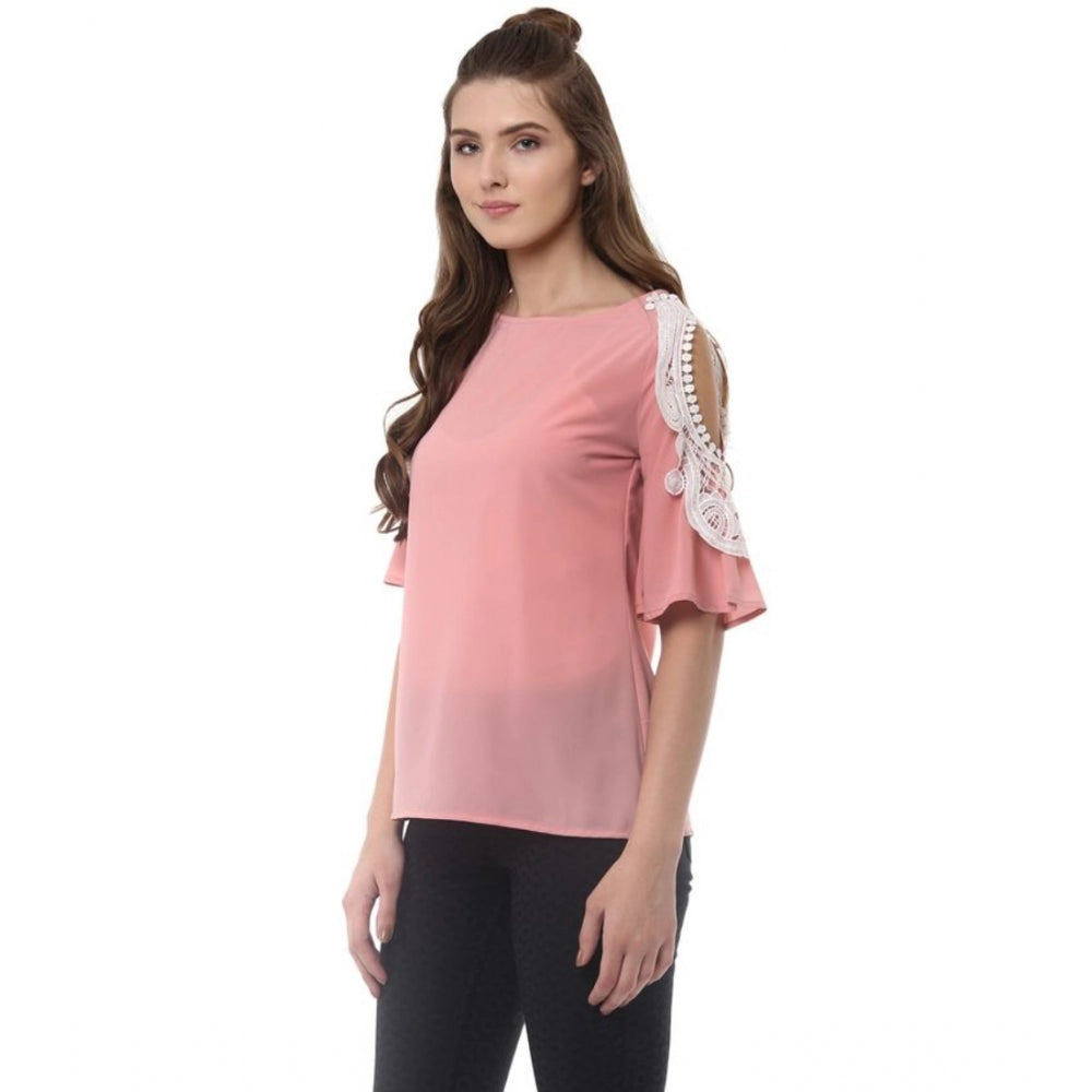 Women's pink polyester lace-insert half sleeve top with round neck, close-up detail