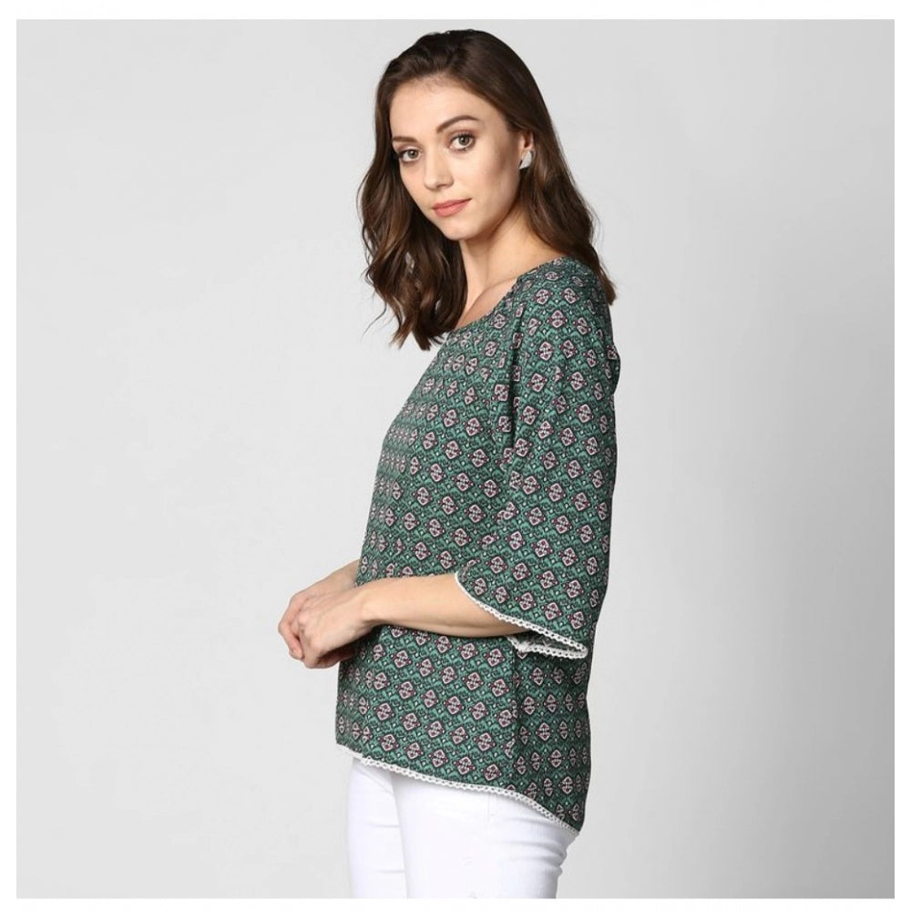 Green polyester printed women's 3/4th sleeves top with round neck, featuring vibrant design