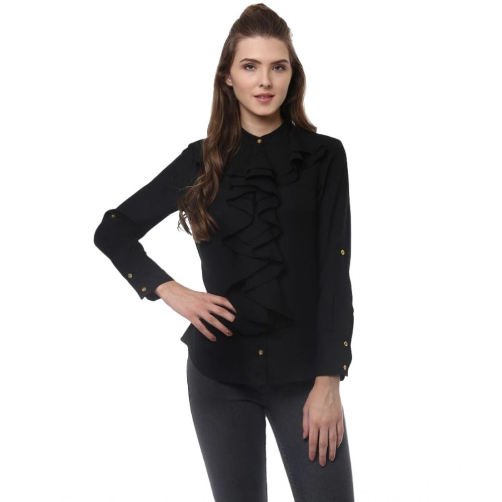 Black polyester ruffled long sleeves top for women with closed neck, detailed view on mannequin