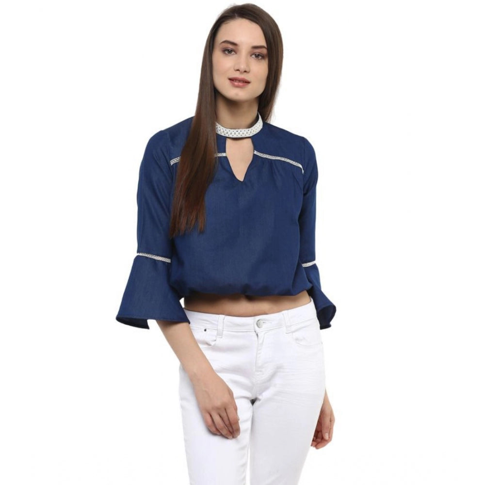 Women's blue polyester bell sleeve top, solid design with keyhole neckline on display