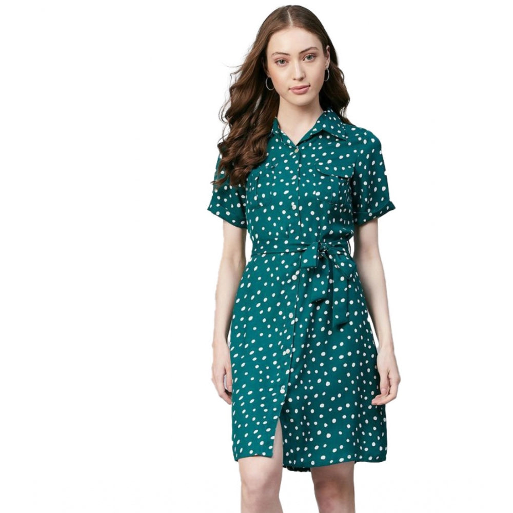 Woman in blue polka dot dress with short sleeves
