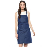Blue denim dress with above knee length, shoulder straps, and solid color. Suggests casual wear