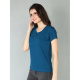A woman in a blue, cotton blend short sleeve t-shirt with a sweetheart neckline