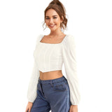 White polyester long-sleeve square neck top, solid design on model