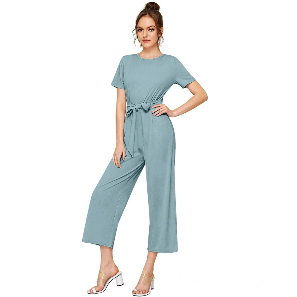 Women's knit jumpsuit with elastic sleeves in solid pista color