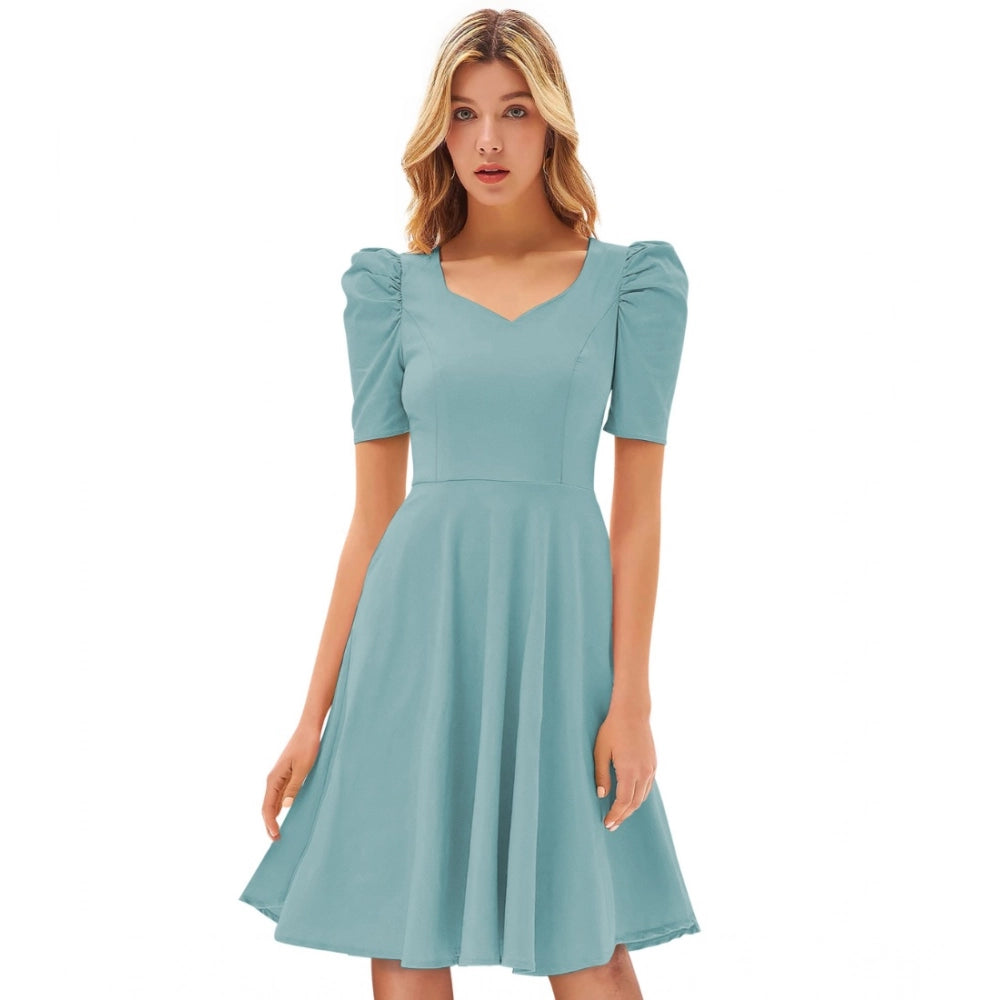 Teal knit strapless dress with ruffled cuffs and hem