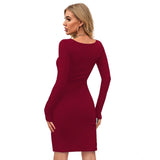 The image displays a full-length, maroon knit dress with long sleeves and a round neckline on a model