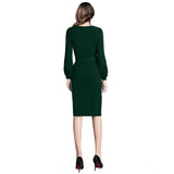 Green knitted dress with full sleeves, round neckline and stretchy fabric