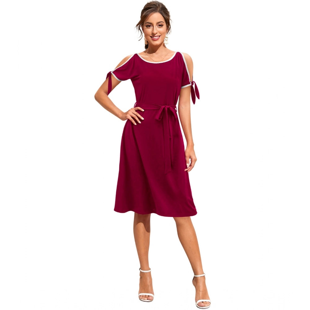 Maroon sleeveless knit dress with round neck, strap details, and solid color