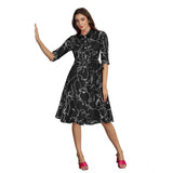 Black, cotton, short-sleeve dress with a collar featuring a print of a small dog
