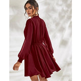 The image depicts a woman wearing a high neck, full sleeve red dress