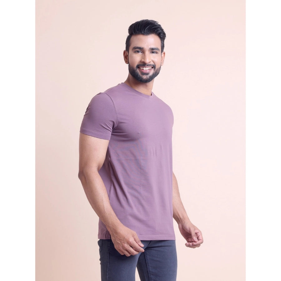 Men's casual berry cotton solid half sleeve round neck t-shirt on model, natural outdoor setting