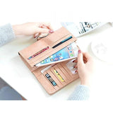 Brown faux leather medium wallet with snap button closure, ideal for everyday use