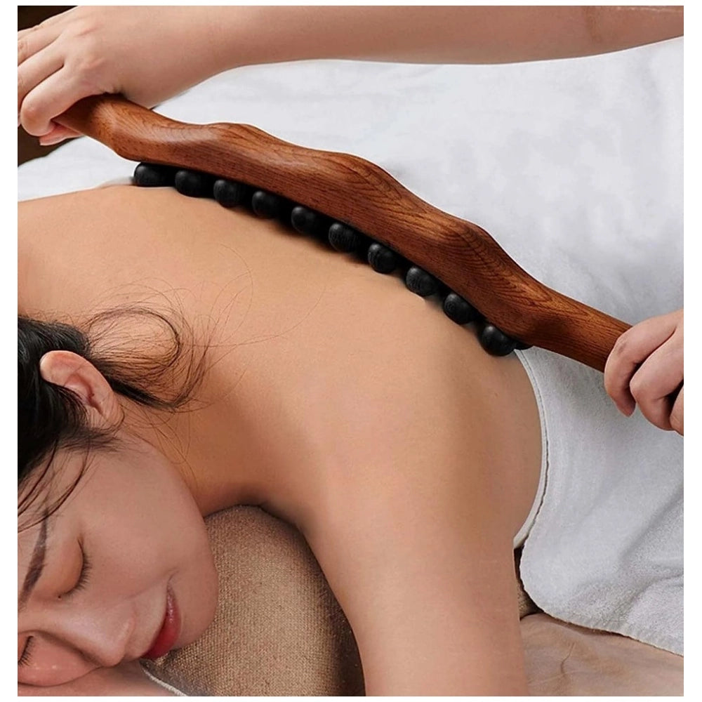 Brown wood Gua Sha muscle relaxation roller for legs, natural wooden tool for self-massage and pain relief on body