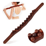 Brown wood Gua Sha massager for muscle relaxation, ideal for back legs and body self-care