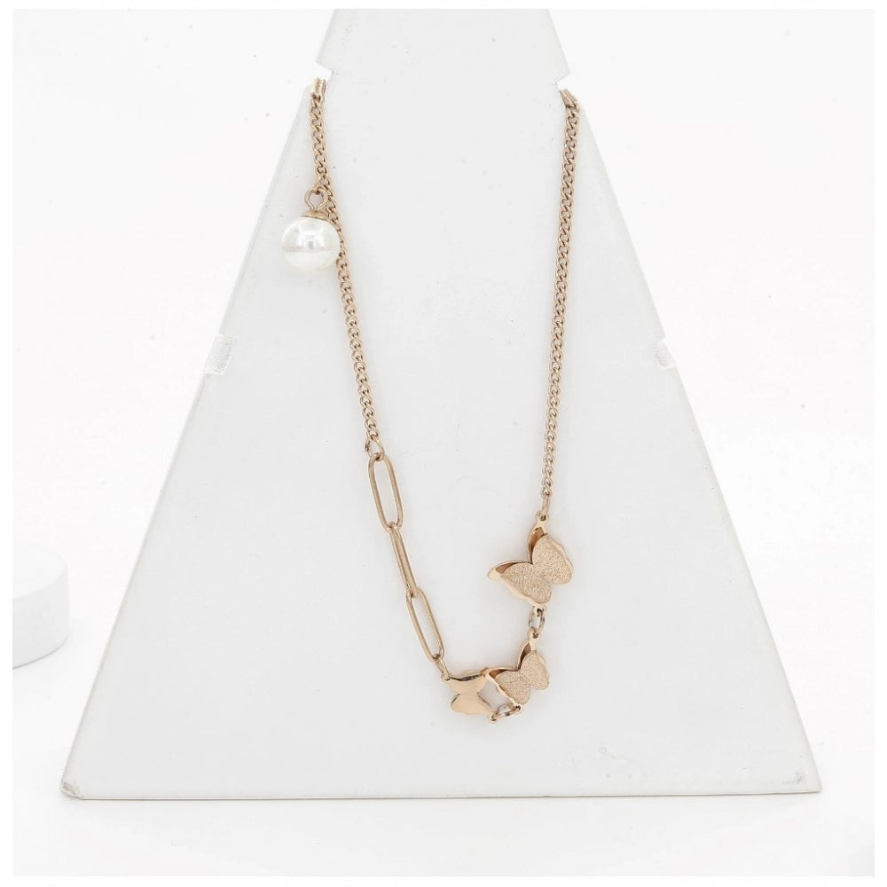 Gold-plated stainless steel butterfly pendant on delicate chain, close-up view