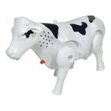 Multicolor plastic electric milk cow with moving legs and shaking tail - children's toy on display stand