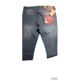 Blue cotton blended men's tapered jeans, solid style with mid rise and button closure on model