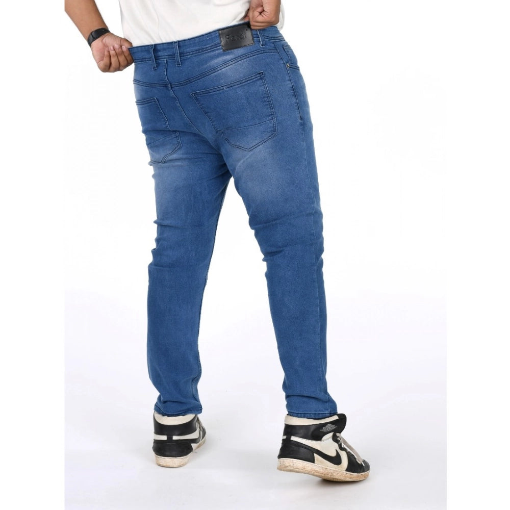 Men's cotton blended solid plus size jeans, blue - mid-rise with button closure on model