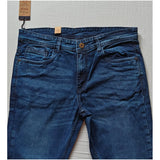 Men's blue cotton blended tapered jeans, solid pattern with mid rise and button closure