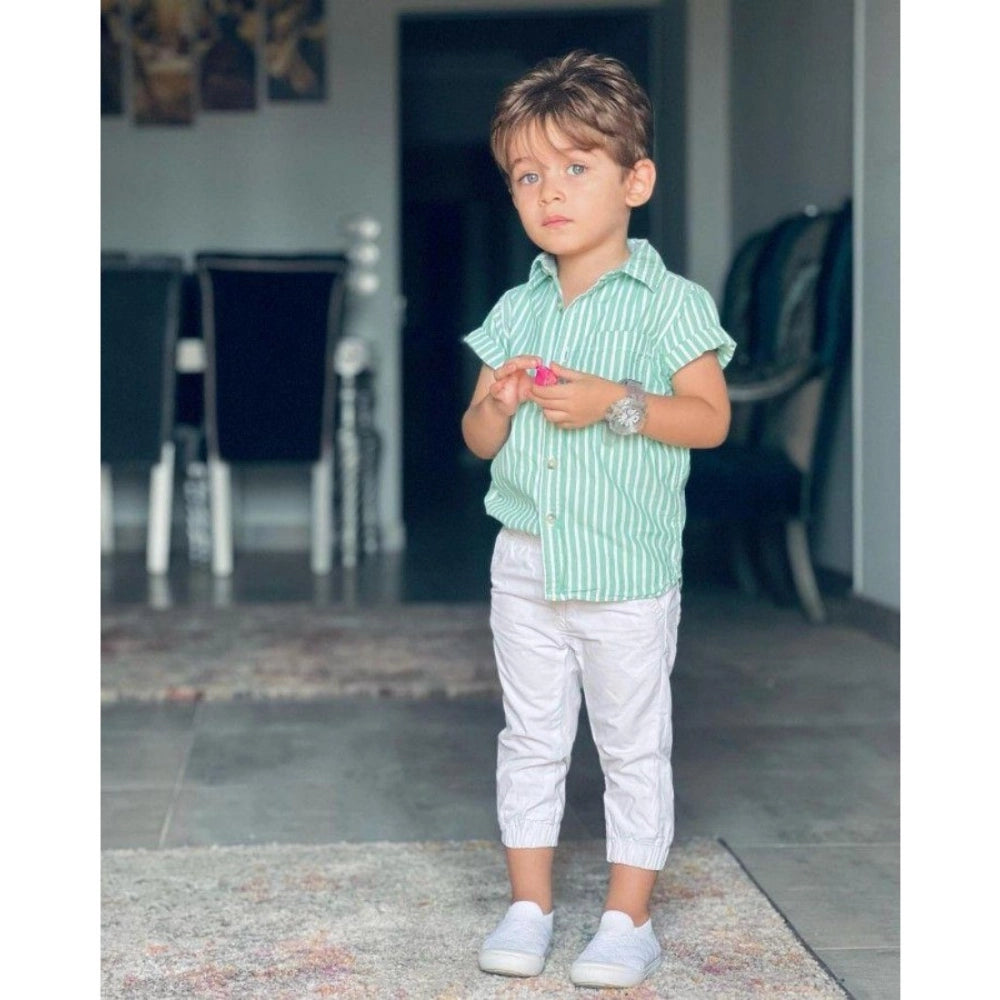 Green Lycra printed casual wear kid's shirt and shorts set, short-sleeved boy's outfit with vibrant pattern on display
