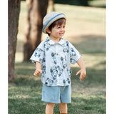 Sky blue kid's lycra printed casual wear shirt and shorts set, short sleeve boy's shorts on display with printed design