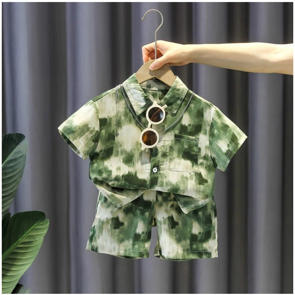 Green Lycra printed boy's casual wear shirt & shorts set, short sleeve design on display