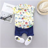 White Lycra printed casual wear shirt and shorts set for kids, featuring short sleeves and playful patterns