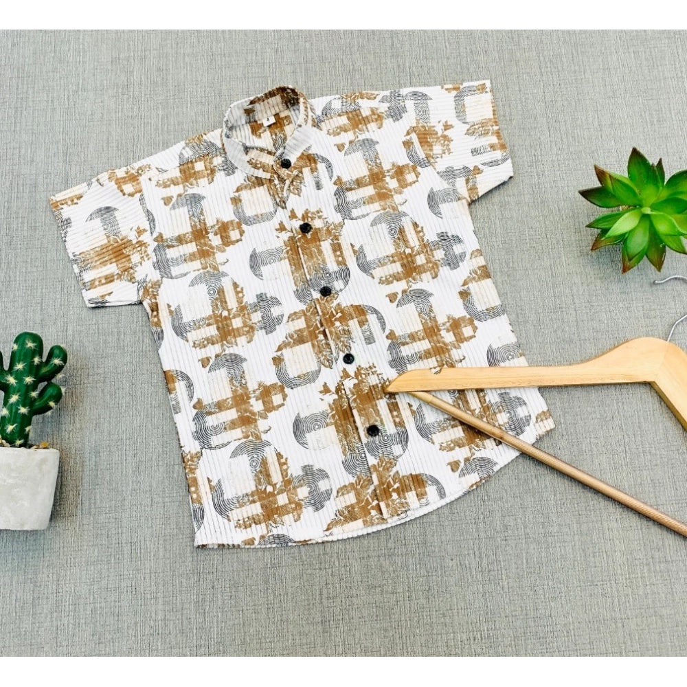 Multi-color cotton blend printed short sleeve boy's shirt, vibrant design on casual wear for kids