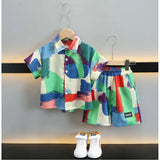 MultiColor Lycra blend printed short sleeve shirt & shorts set for kids, activewear with vibrant patterns on display