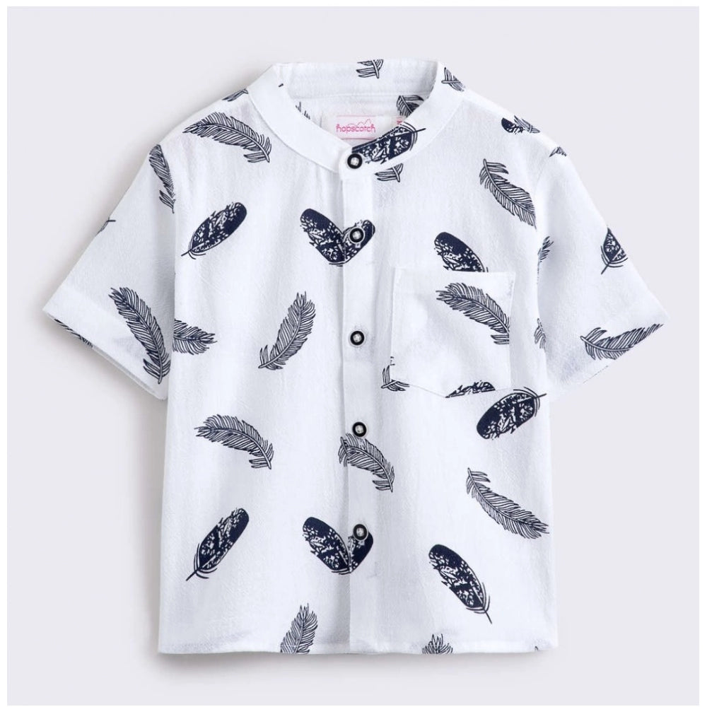 White cotton blend boy's printed short sleeve shirt & shorts set, vibrant patterns on soft fabric for playtime fun