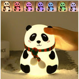 Plastic, silicone panda lamp with a fluffy tail and a festive bow necklace